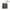 Keukenafval compostemmer zwart van Joseph Joseph op aanrecht met klep open en groene verluchting rooster zichtbaar waarin boontjes worden weggegooid