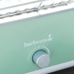 Close-up van regelknop van groene BBQ e-carlo elektrische tafelgrill van Barbecook