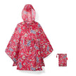 mini maxi poncho paisley ruby opgevouwen naast opbergzakje 