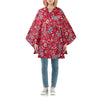 mini maxi poncho paisley ruby die gedragen wordt door vrouw 